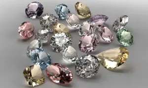 Bunte Edelsteine, was ist wertvoller als Diamant? Ein Haufen funkelnder, geschliffener Juwelen in Rosa, Blau, Grün und Gelb.